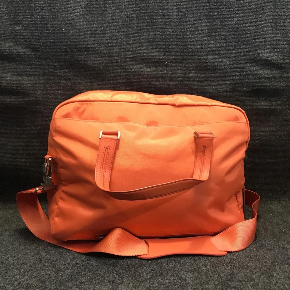 Tumi Model 4892MLN Voyageur Tangerine Nylon Weekender Travel Shoulder Duffel Bag